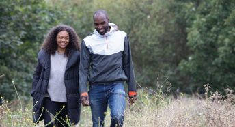 A couple walking and laughing together